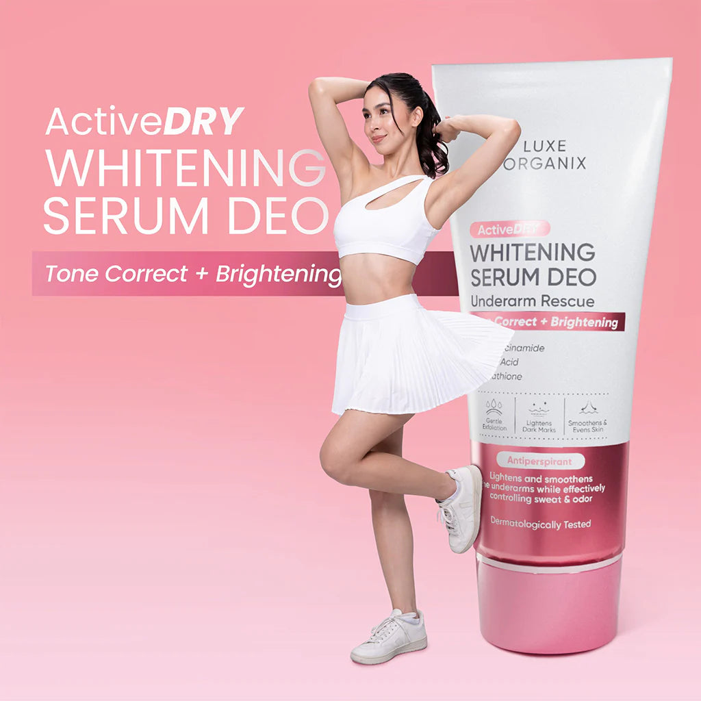 Woman posing with a Whitening Serum Deo product on a pink background