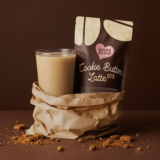 Glass of Cookie Butter Latte next to a package labeled 'Cookie Butter Latte DTX' on a brown background.