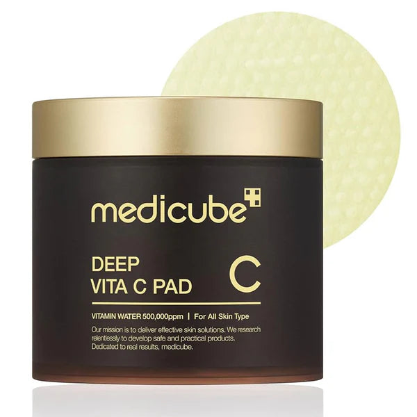 Medicube Deep Vita C Pad with a gold lid on a white background