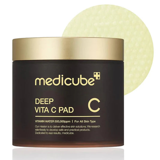 Medicube Deep Vita C Pad with a gold lid on a white background