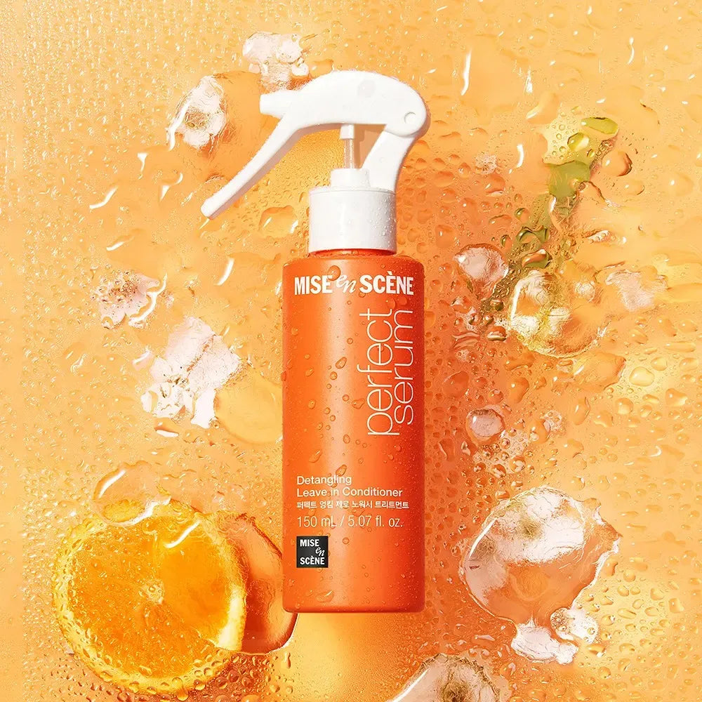 Mise en Scène perfect serum bottle with orange slices and ice cubes on a yellow background