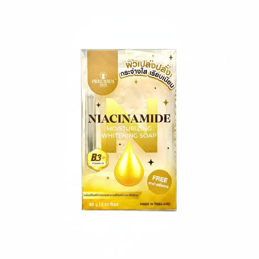 Package of Niacinamide soap with gold accents on a white background
