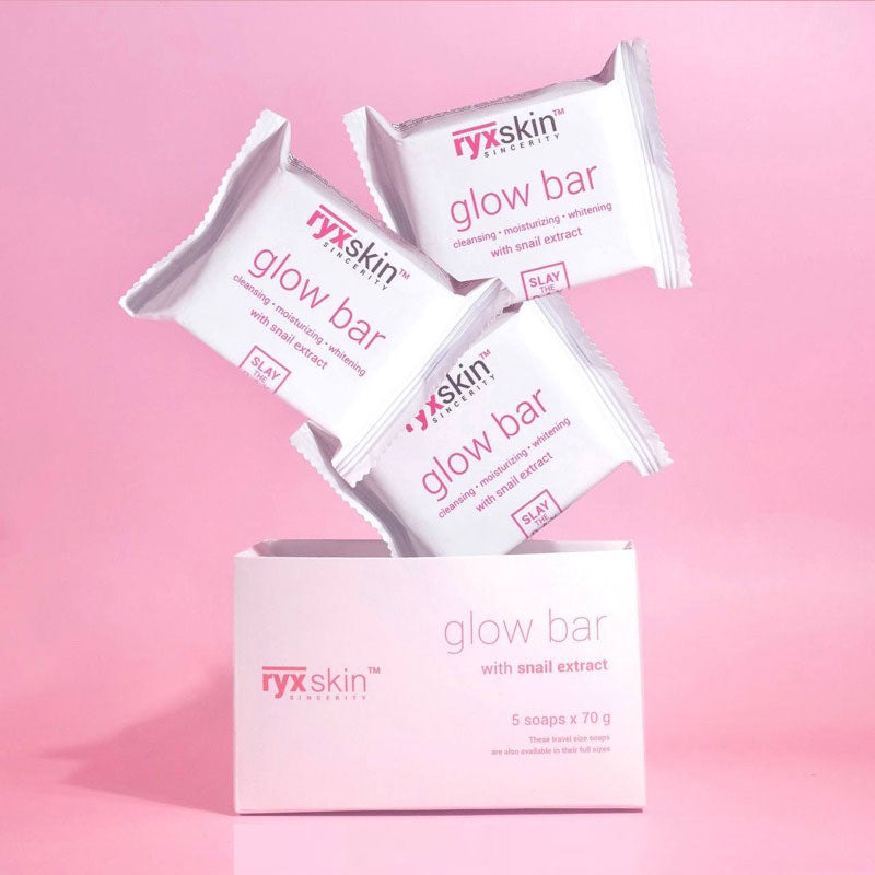 ryxskin glow bar packaging on a pink background