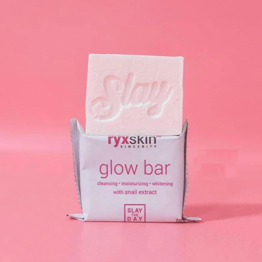 ryxskin glow bar with pink soap on a pink background