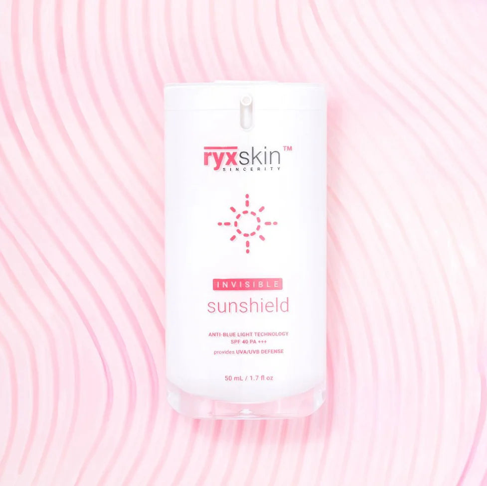 Ryx Skin Sunshield packaging on a pink background