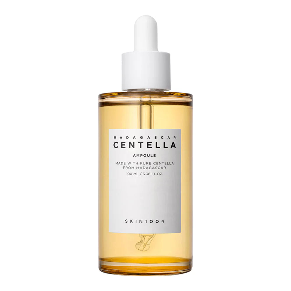 A clear glass bottle with a dropper containing yellow liquid, labeled as 'Madagascar Centella Ampoule'.