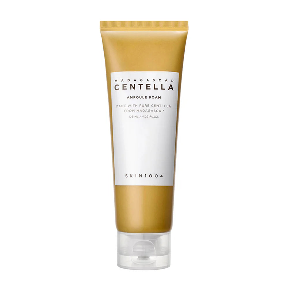 A tube of Madagascar Centella Ampoule Foam by SKIN1004, with a beige body and white label.