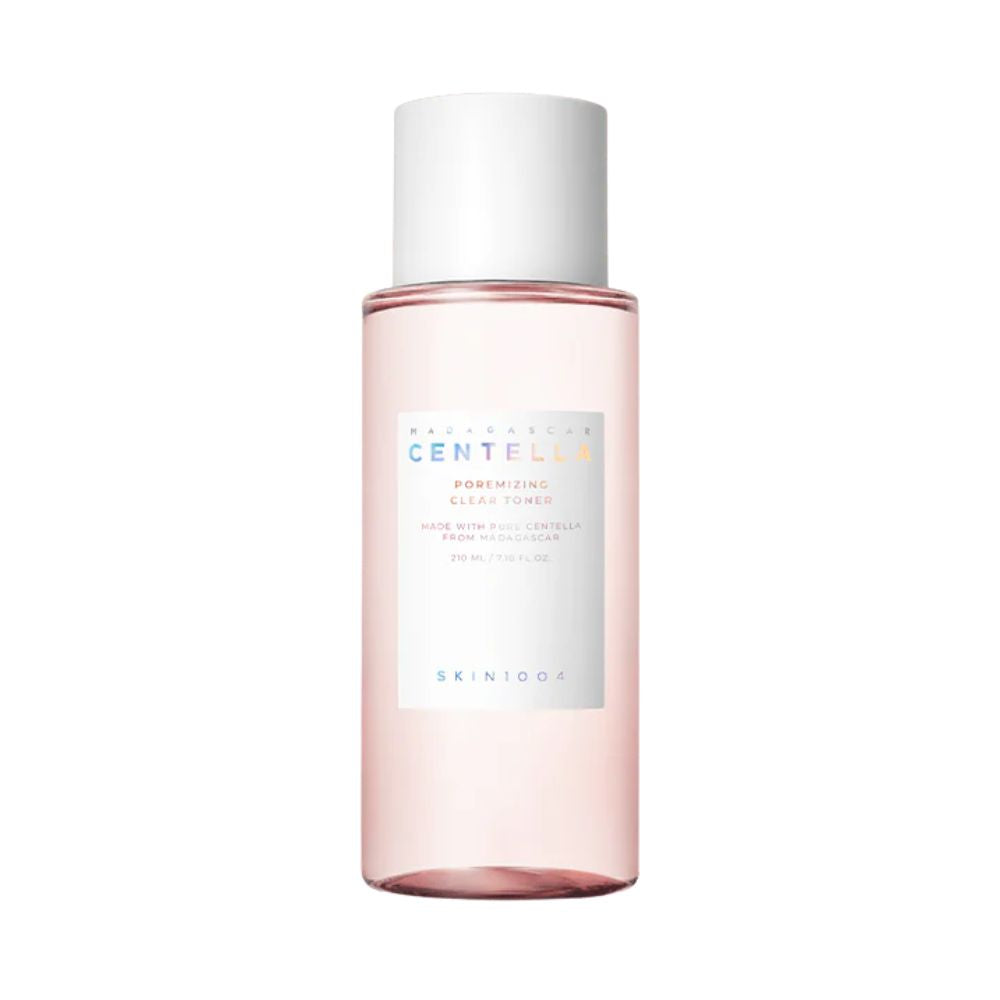 Pink skincare bottle with white cap on a white background