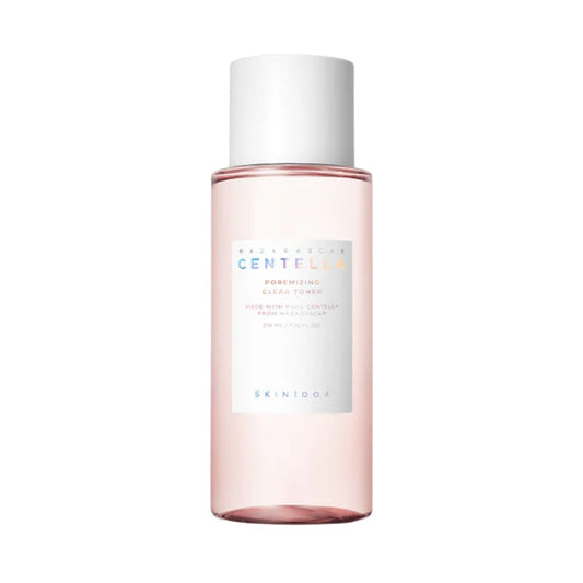 Pink skincare bottle with white cap on a white background
