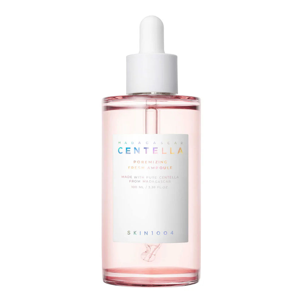 A clear glass bottle with a dropper containing a pink-toned skincare ampoule, labeled 'CENTELLA', on a white background.