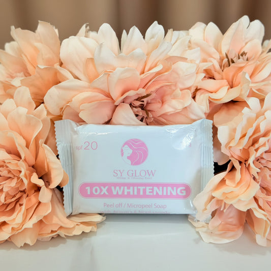 SY Glow 10X Whitening peel-off mask surrounded by peach flowers on a beige background