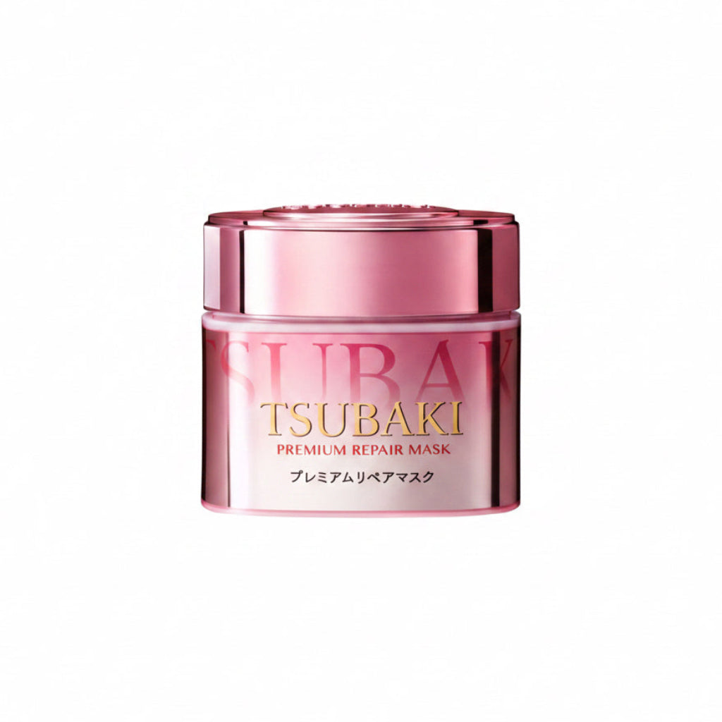 Pink jar of Tsubaki Premium Repair Mask on a white background