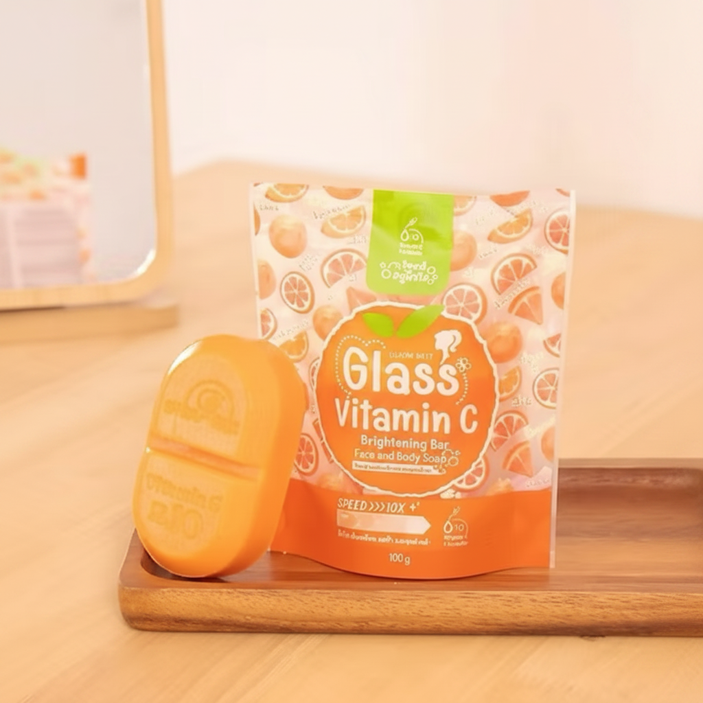 Orange soap bar and packaging on a wooden surface