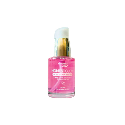 Pink serum bottle labeled 'Honest Glow' on a white background
