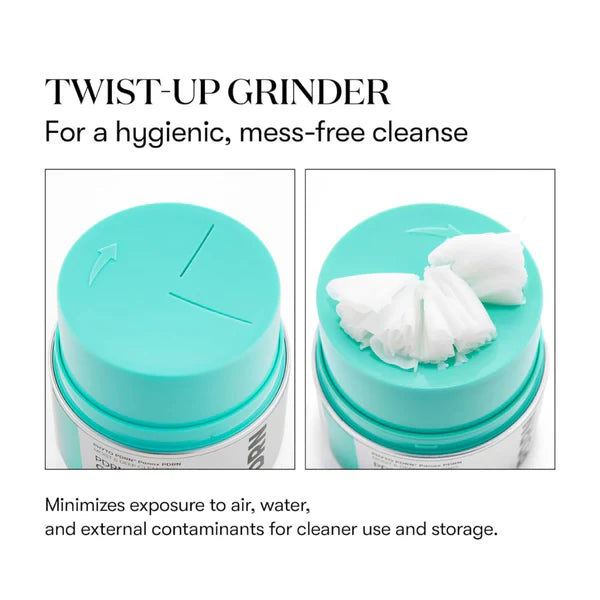 Turquoise twist-up grinder with cotton pads on a white background