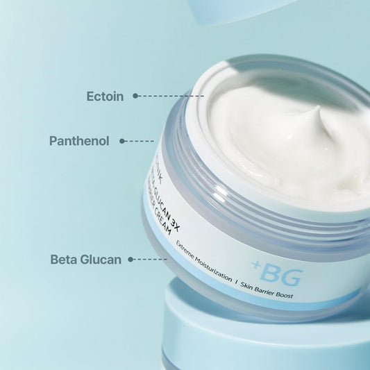 Jar of cream with labeled ingredients on a light blue background