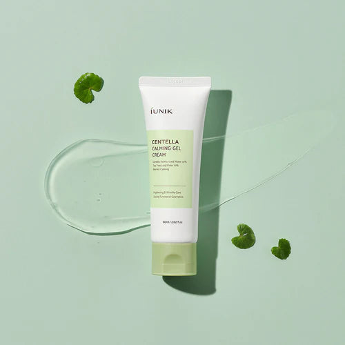 Tube of Unik Centella Calming Gel Cream on a light green background with green leaves.